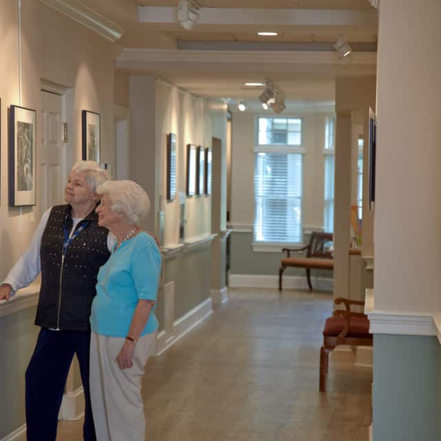 Goddard House residents admiring gallery