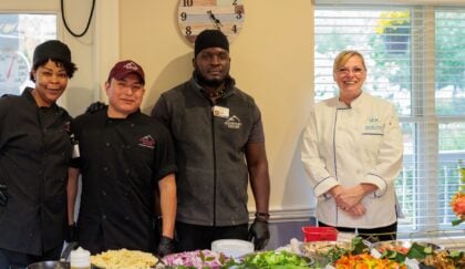Members of Goddard House's culinary team posting at event