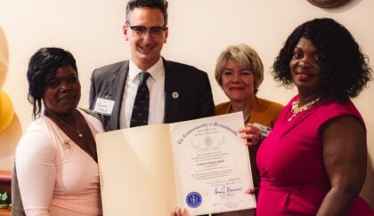 Goddard House Executive Director, State Representative Tommy Vitolo holding citation, Goddard President & CEO, and Goddard Lead Resident Care Associate
